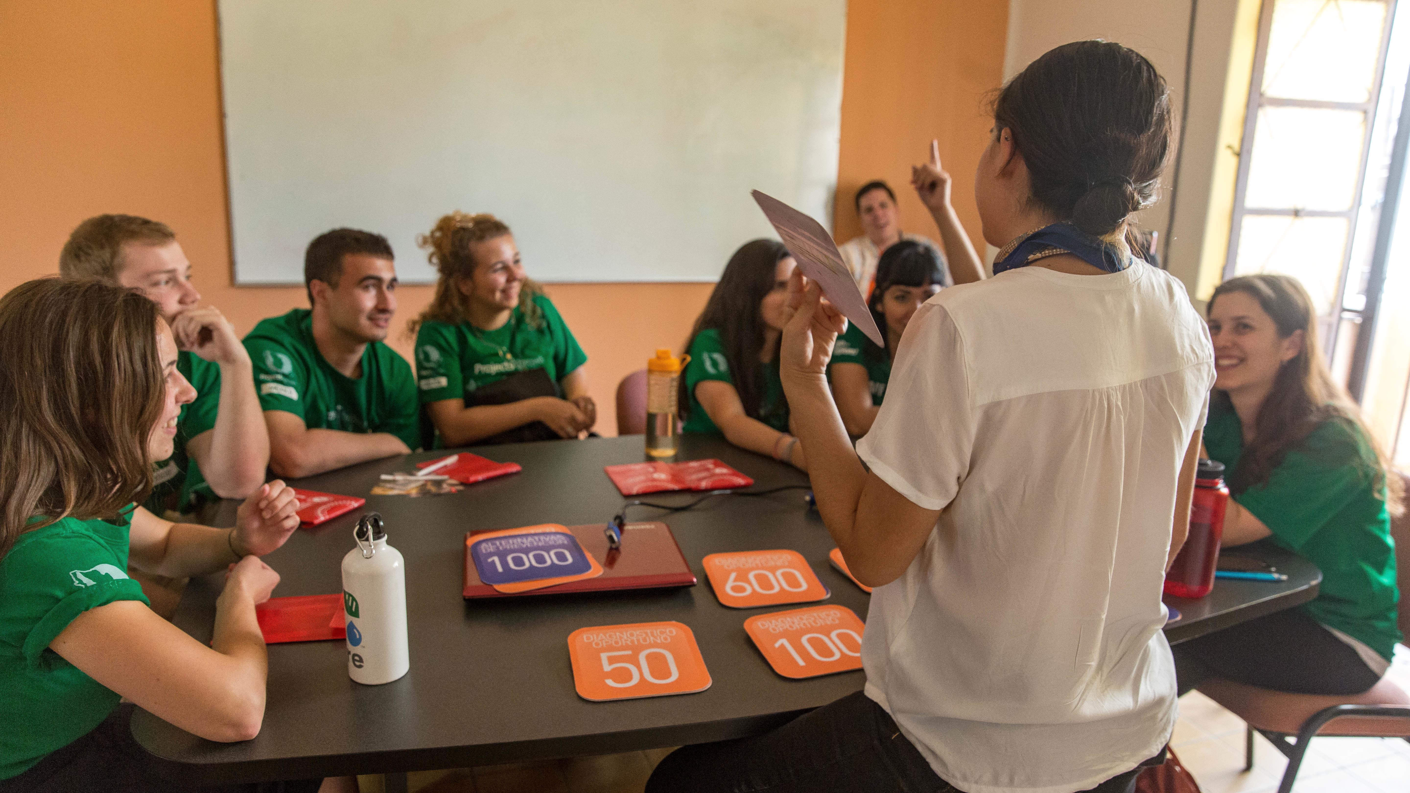 A group of Nursing and Medicine interns play a medical matching game during a workshop with a local doctor at a hospital in Mexico. A local doctor teaches Projects Abroad Nursing and Medicine interns through a matching game at their hospital placement in Guadalajara, Mexico.
